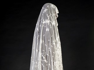 Wedding veil, netting with Limerick lace floral work and scalloped edging.