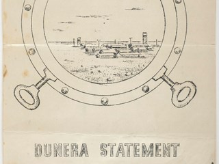 Seven page, double sided, foolscap size typed document, stapled at top left corner (with last page having separated). The front cover has a hand drawn, printed image of a porthole open and looking into a view of an internment camp. It is entitled 'Dunera Statement'.