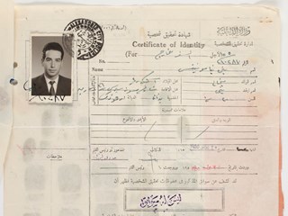 'Certificate of Identity' printed on cream paper, with photo of donor attached. Ink stamped 'Alexandria city'. Document printed and completed in Arabic.