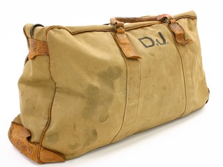 Large khaki coloured canvas bag with leather trim and leather handles (secured to the bag on fixed leather strips and metal rings).