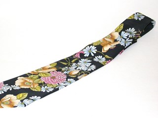 Black silk tie with pink, blue, green, yellow and brown floral pattern. Broad seventies style.