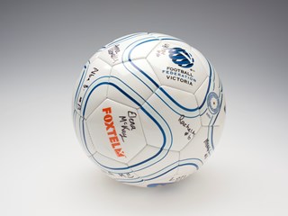 Size 4 white soccer ball with advertising and autographs from the 2010 Brunswick Zebras Under 18 Girls soccer team.