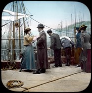 Man and woman saying farewell on deck of sailing ship, 1890, in a tinted photograph