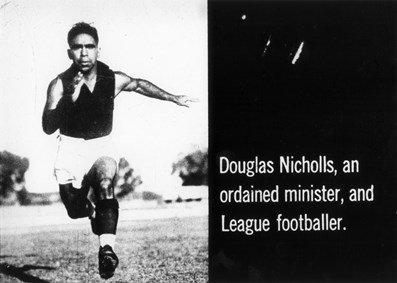 Doug Nicholls running towards the camera in football togs circa 1930s