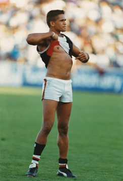 St Kilda footballer Nicky Winmar raising his guernsey towards opposition spectators as he shouted "I’m proud to be black"