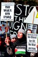 Protestors in hijab bearing anti-Iraq War placards, 2002.