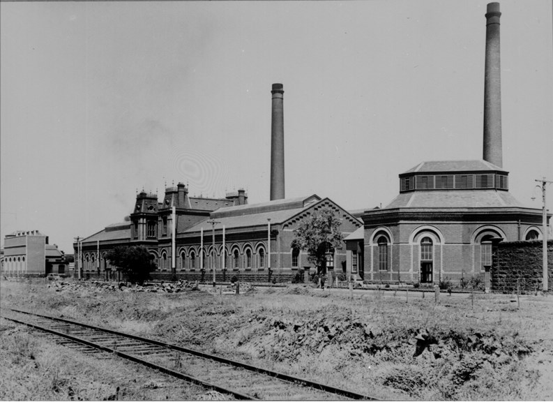 View of Spotswood Pumping Station eastern frontage, showing rail siding to oil terminals, both chimneys and 25-cycle substation, circa 1938.