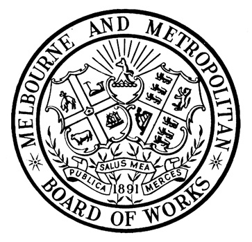 M.M.B.W. corporate logo. The design incorporates the shields of the City of Melbourne and British Royal Coats of Arms in the centre with a kangaroo in front of a rising sun above them. Below the shields is a scroll bearing the Latin motto 'Publica Salus Mea Merces' (meaning 'Public Health is my Reward'), above the date '1891' representing the year the organisation was formed. Around the perimeter in a ring are is the title 'MELBOURNE AND METROPOLITAN * BOARD OF WORKS * '