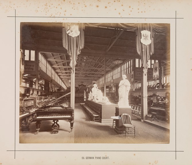 Interior view of the German Piano display in the Royal Exhibition Building during the Melbourne International Exhibition of 1880. Caption reads: 59. German Piano Court.