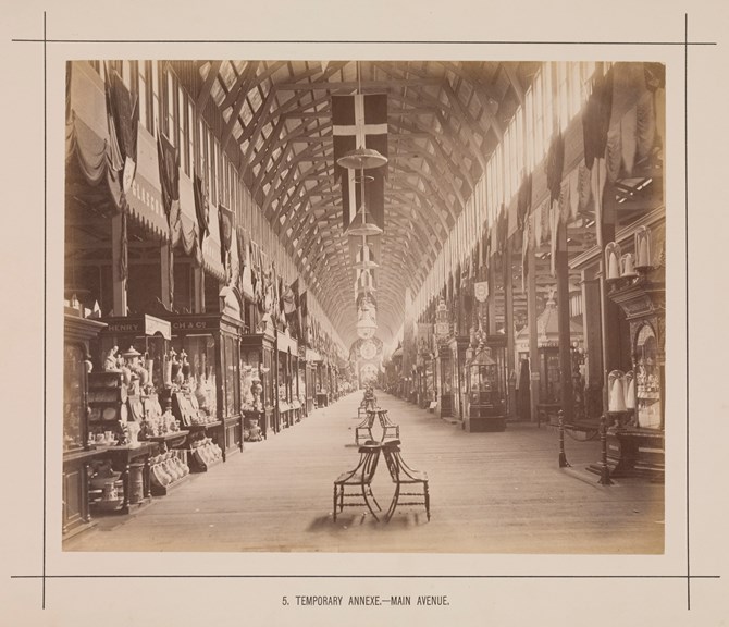 Main avenue of the temporary annexe to the Royal Exhibition Building during the Melbourne International Exhibition of 1880. Caption reads: 5. Temporary Annexe.- Main Avenue