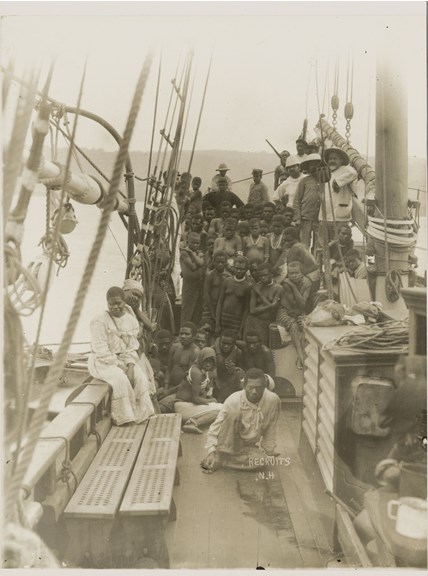 Photograph of a group of people on a ship