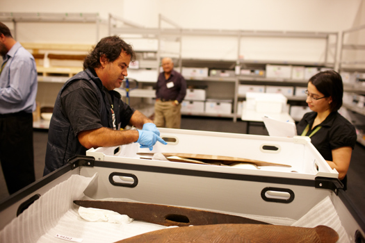 Yulendj member Brendan Kennedy talks with curator Louise Gray about First Peoples exhibition objects. Elder Sandy Atkinson is in the background.