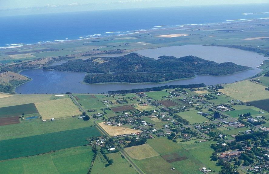 Aerial photograph of Tower Hill, a lake-filled extinct maar volcano with a group of scoria cones with craters forming islands