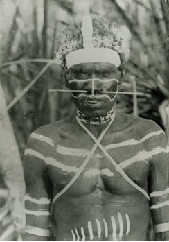 Aboriginal man wearing a beaded neckband