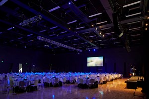 Large room with function tables set up banquet style