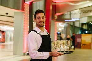 Waiter holding a tray champagne glassess
