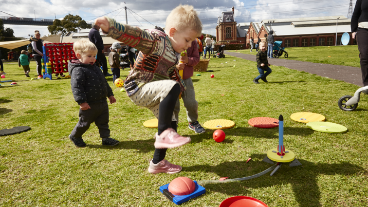  Child playing with a toy rocket in the arena at Scienceworks, during Little Kids' Day In.