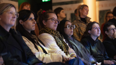 Row of seated women watching a talk at Melbourne Museum.