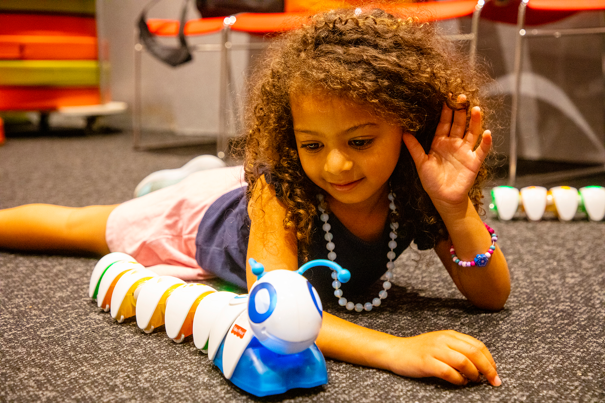 Child playing with a Code-a-pillar in the Energy Lab during the Little Kids Day In program at Scienceworks, February 1st, 2021.