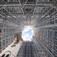 Scaffolding lining the walls of a Notre Dame courtyard. 