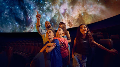 A family in the Scienceworks Planetarium in Melbourne.