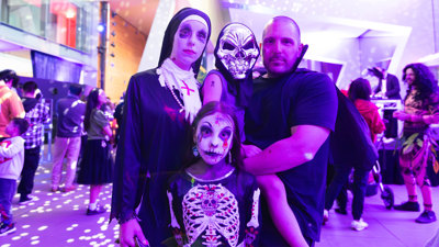 A family dressed as vampires and the undead during Halloween at the Museum.