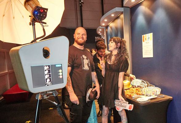 People using a photo booth and props at Scienceworks.