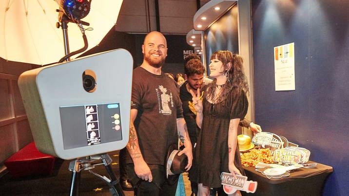 People using a photo booth and props at Scienceworks.