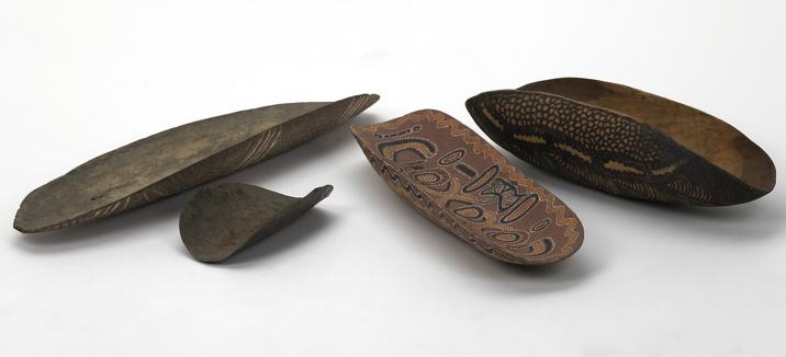 Set of decorated wooden dishes and scoop with carved and painted patterns