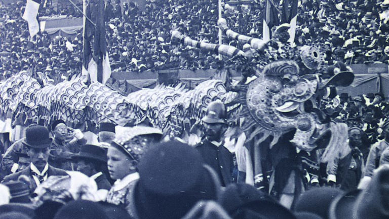 a black and white image of a Chinese parade dragon
