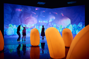 people behind giant eggs in antopia exhibition