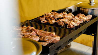 Chicken cooking on a grill.