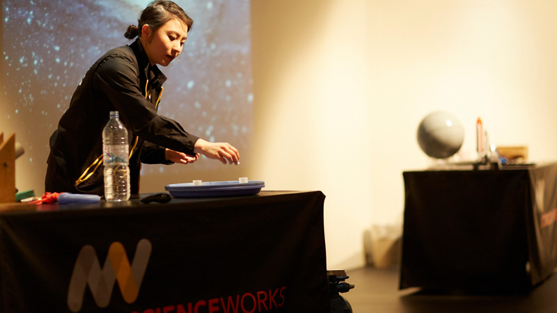 A Scienceworks presenter prepares an alka-seltzer rocket demonstration in the Blast Off show.