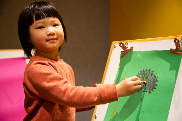 Child creating their own story of Caring for Country by colouring a native animal in the Energy LAB, during the Little Kids Day In - Caring for Country program at Scienceworks.