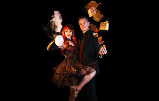 Becky Bubbles holding a smoke filled bubble and Mr Marmalade flipping cards from his wrist.