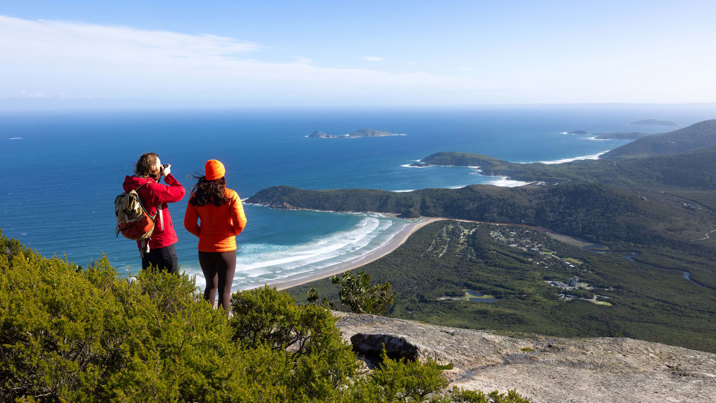 Two visitors enjoying the view at the Mount Oberon Summit, Wilsons Promontory National Park
