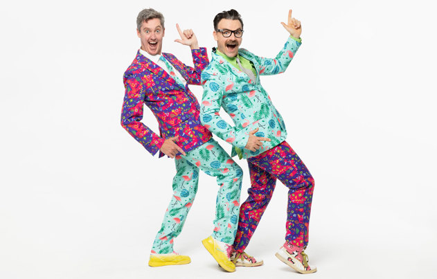 The Listies wearing colourful suits and posing.