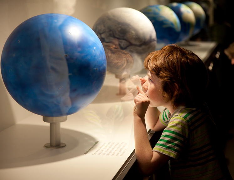 A child views the globe display at the launch of the Dynamic Earth exhibition.