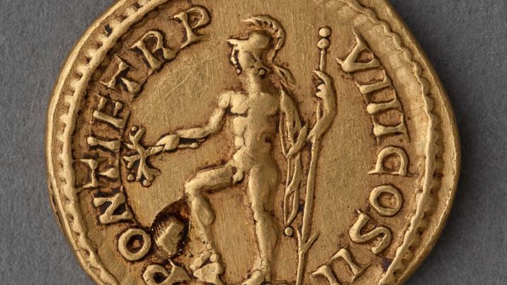 Gold Roman coin featuring a nude gladiator posing.