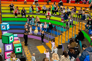  Families engaging with the Robo-Boogie activity in the Amphitheatre during Little Kids Day In program at Scienceworks