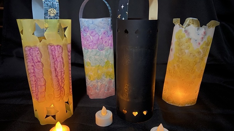 Colourful hand-made candlelit paper lanterns.