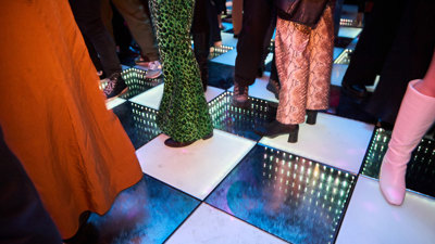 Peoples legs on the disco dance floor at Discoteca Italiana, Melbourne Museum.