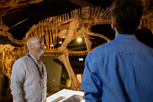 A man on tour of Dinosaur Walk exhibition at Melbourne Museum.