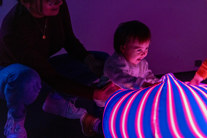  Mother and child exploring the Glow Lab activity held in the Energy Lab, during the 'Little Kids day In - Ready, Set, Glow' event at Scienceworks.