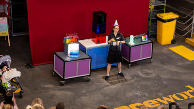 A presenter explaining an experiment to an audience