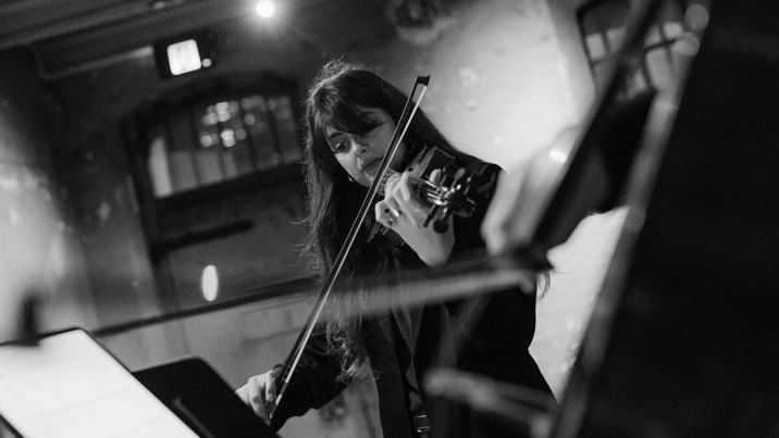 A woman playing a violin