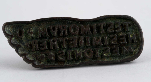 Bronze wax seal maker in the shape of a foot from the Imperial age