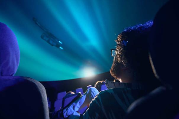 A man watches a film at the planetarium at Scienceworks.