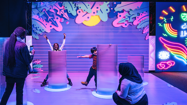 Two children playing in Illuminate How Science Comes To Light Echibition.