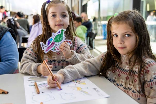 Children decorating their Our Wondrous Country drawing at Melbourne Museum.